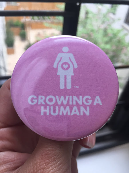 Growing a Human Graphic Pin - English